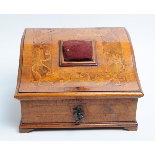 217 - Early 20th century Walnut veneer sewing box with a sloping hinged lid featuring a pin cushion mounte... 