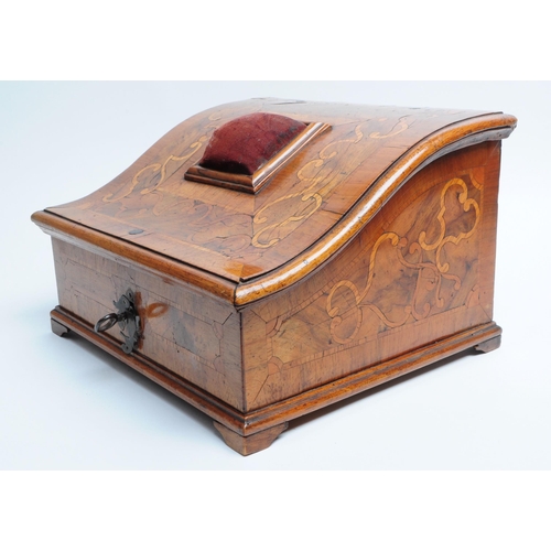 217 - Early 20th century Walnut veneer sewing box with a sloping hinged lid featuring a pin cushion mounte... 