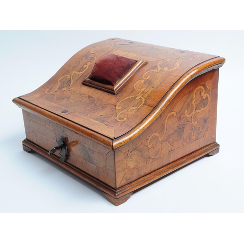 217 - Early 20th century Walnut veneer sewing box with a sloping hinged lid featuring a pin cushion mounte... 