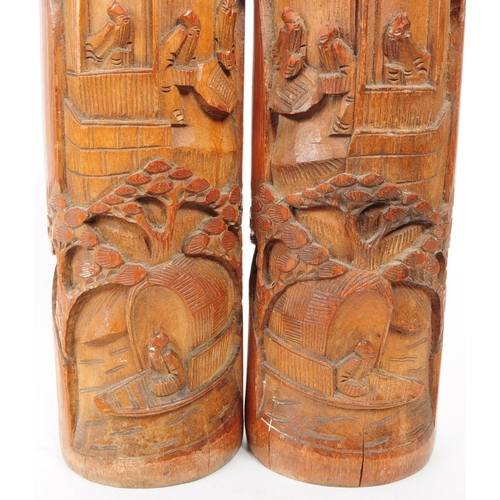 220 - A pair of 20th century Chinese bamboo brush pot vases. Each with a carved relief design depicting a ... 