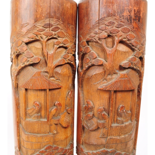 220 - A pair of 20th century Chinese bamboo brush pot vases. Each with a carved relief design depicting a ... 