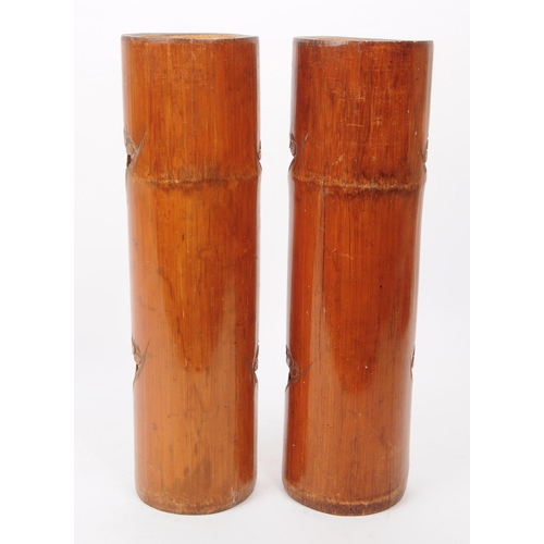 220 - A pair of 20th century Chinese bamboo brush pot vases. Each with a carved relief design depicting a ... 