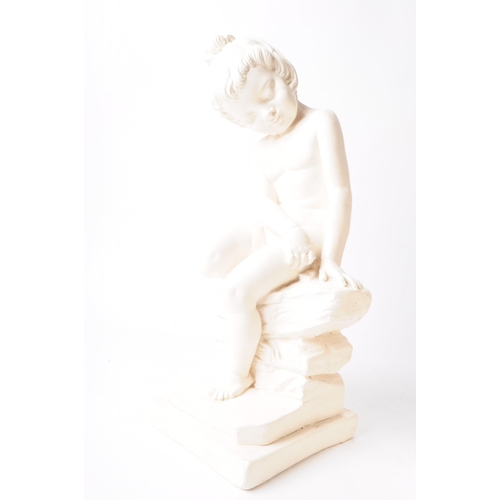 221 - A pair of two late 20th century plaster cherub figures, a boy and a girl depicted sitting on rocks. ... 