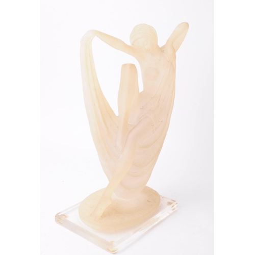 224 - Late 20th century resin art deco style dancer figure depicted half nude and draped in fabric. Raised... 