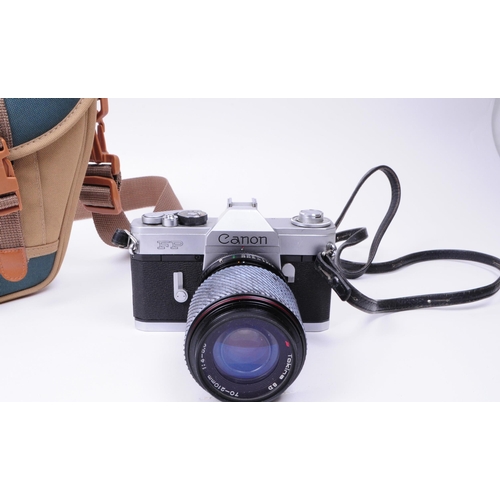 228 - Canon - A vintage mid 20th century Canon FP 35mm SLR camera. The camera in silver colourway, alongsi... 