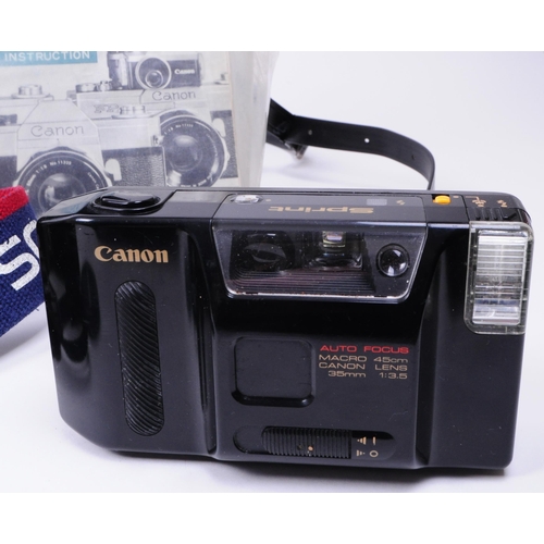 229 - Canon - A collection of vintage late 20th century Canon 35mm cameras and accessories. The collection... 