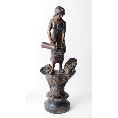 230 - Two early 20th century French spelter figurines from the L'Agriculture series depicting male and fem... 