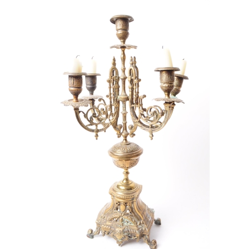 236 - Two Victorian late 19th century brass garniture candelabra. Both features ornate detailing, four arm... 