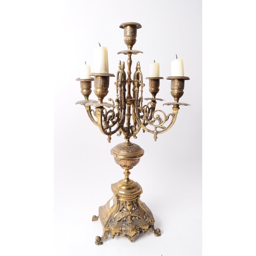 236 - Two Victorian late 19th century brass garniture candelabra. Both features ornate detailing, four arm... 