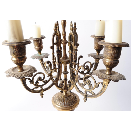 236 - Two Victorian late 19th century brass garniture candelabra. Both features ornate detailing, four arm... 