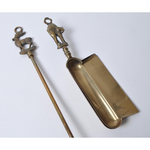 239 - 20th century brass fireside implements, comprised of dust pans, brushes, pokers, and shovels. Each t... 