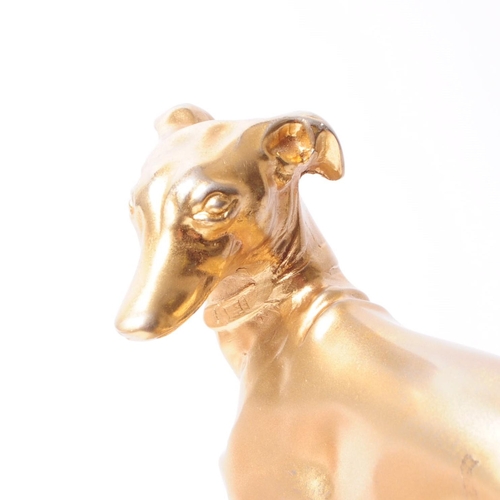 249 - 20th century vintage gold toned metal whippet / greyhound sculpture mounted on a green alabaster bas... 