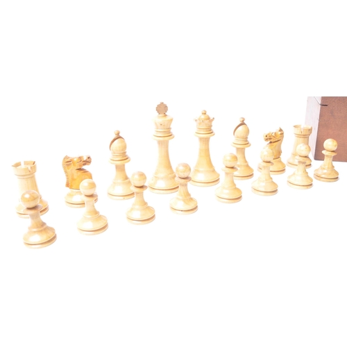 251 - A vintage 20th century turned wooden chess set. Having all thirty two pieces, in Staunton pattern. H... 