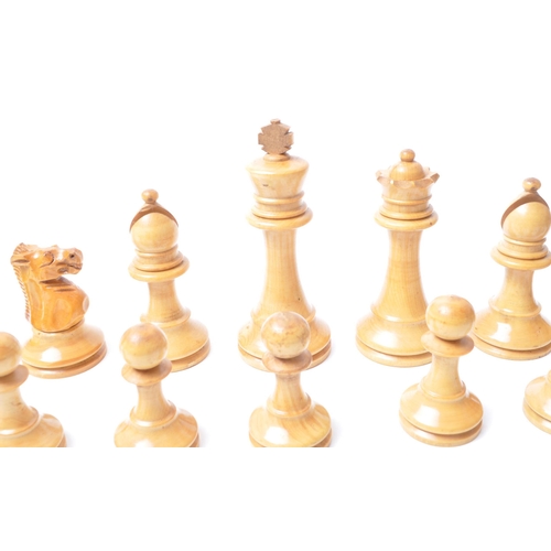 251 - A vintage 20th century turned wooden chess set. Having all thirty two pieces, in Staunton pattern. H... 