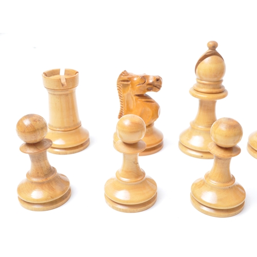 251 - A vintage 20th century turned wooden chess set. Having all thirty two pieces, in Staunton pattern. H... 