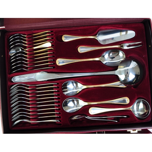 254 - Solingen - West German 1829 23-4 carat gold plated twelve setting cutlery canteen with certificate o... 