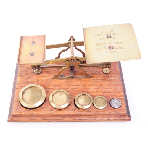 255 - Set of Victorian oak and brass postal scales. Oak base complete with full set of brass weights. Inla... 