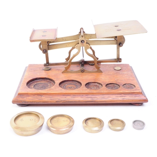 255 - Set of Victorian oak and brass postal scales. Oak base complete with full set of brass weights. Inla... 