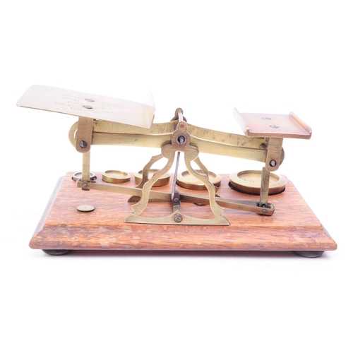 255 - Set of Victorian oak and brass postal scales. Oak base complete with full set of brass weights. Inla... 