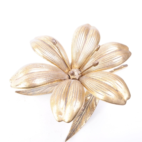 256 - A vintage mid 20th century brass floral lily ashtray. The ashtray in the form of a lily flower, with... 