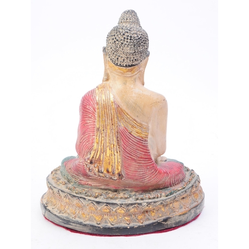 263 - An early 20th century Thai buddha figure. The figure in seated postition, with legs crossed and arms... 