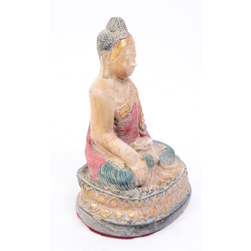 263 - An early 20th century Thai buddha figure. The figure in seated postition, with legs crossed and arms... 