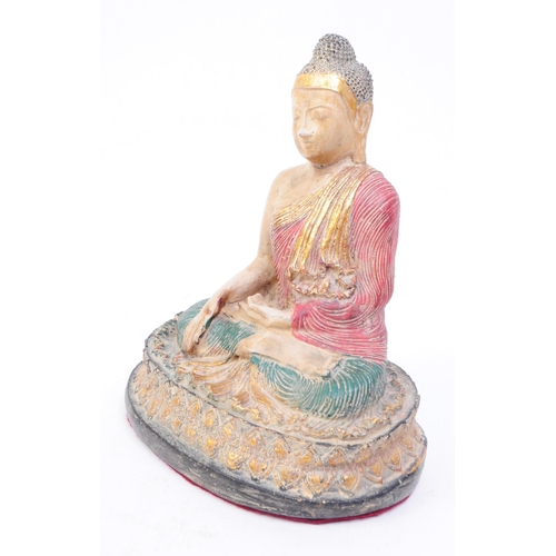 263 - An early 20th century Thai buddha figure. The figure in seated postition, with legs crossed and arms... 