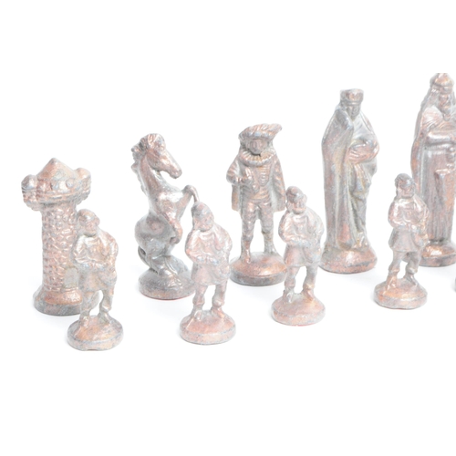 269 - 20th century cast metal full chess set comprised of medieval style figures. Largest piece measuring ... 