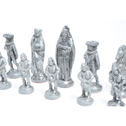 269 - 20th century cast metal full chess set comprised of medieval style figures. Largest piece measuring ... 