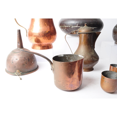 270 - Collection of early 20th century copper items, comprised of three coffee pots, a hammered jug, funne... 