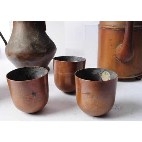 270 - Collection of early 20th century copper items, comprised of three coffee pots, a hammered jug, funne... 