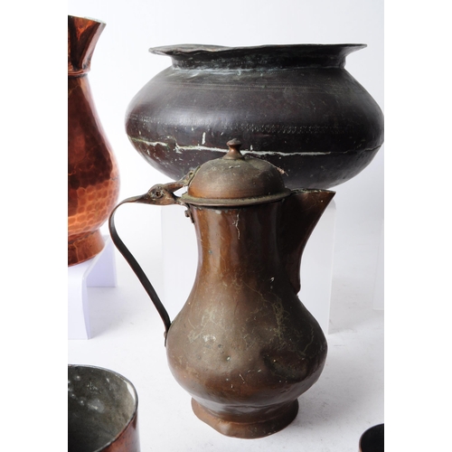 270 - Collection of early 20th century copper items, comprised of three coffee pots, a hammered jug, funne... 