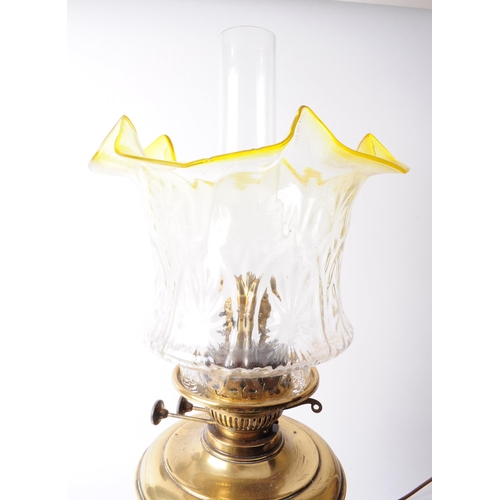 272 - Early 20th century brass oil lamp with glass shade and reservoir. Glass shade in a clear textured fl... 