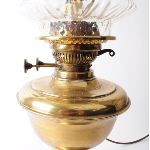 272 - Early 20th century brass oil lamp with glass shade and reservoir. Glass shade in a clear textured fl... 