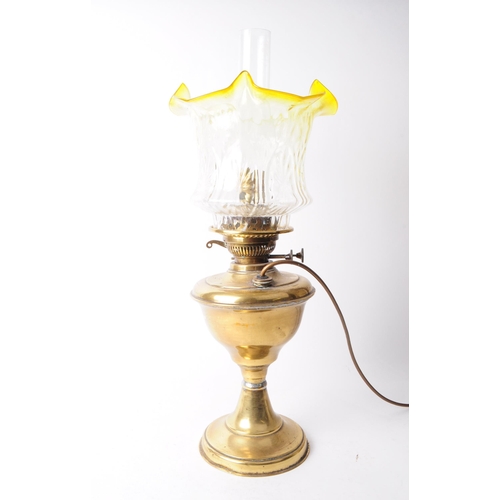 272 - Early 20th century brass oil lamp with glass shade and reservoir. Glass shade in a clear textured fl... 