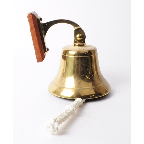 274 - Late 20th century vintage brass bell complete with rope pull, wall bracket and wooden mount. Measuri... 