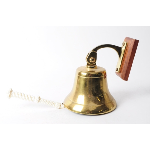 274 - Late 20th century vintage brass bell complete with rope pull, wall bracket and wooden mount. Measuri... 