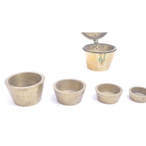 286 - 20th century brass apothecary weights / scales. Overall weighing 500 grams with the brass container ... 