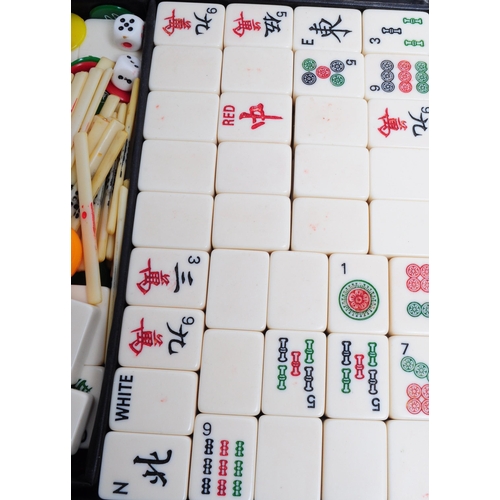 288 - Early 20th century mahjong set housed within a buttoned case. Including the tiles and counting stick... 