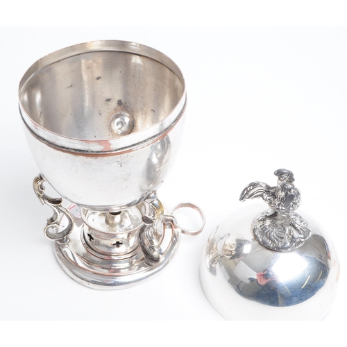 290 - Early 20th century silver plated egg coddler with bird / chicken finial and burner. Measuring approx... 