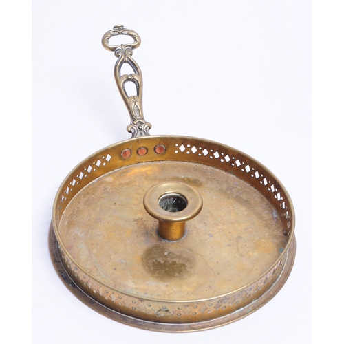 291 - 19th century brass circular candlestick holder / tray with handle and pierced rim. Measuring approx.... 