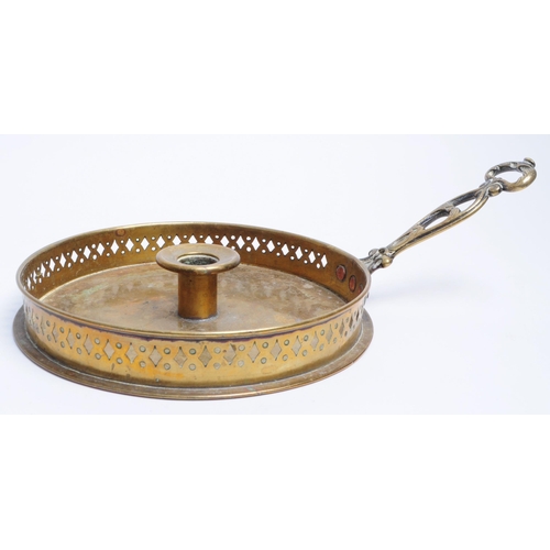 291 - 19th century brass circular candlestick holder / tray with handle and pierced rim. Measuring approx.... 