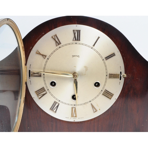 304 - Smiths - Early 20th century art deco mahogany cased mantel clock. Metal clock face with a glazed fro... 