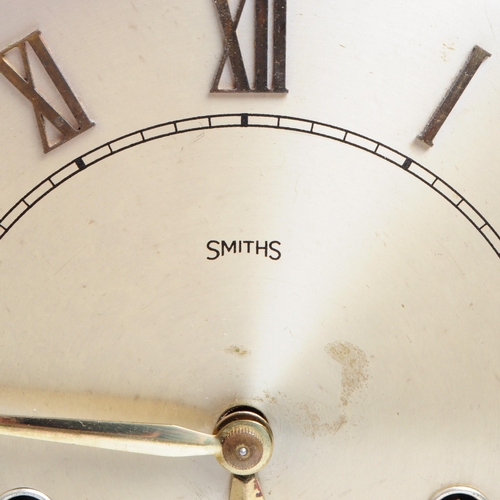 304 - Smiths - Early 20th century art deco mahogany cased mantel clock. Metal clock face with a glazed fro... 