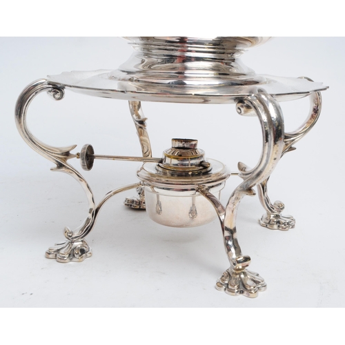 309 - A 19th century silver plated spirit kettle. The spirit kettle base having scrolled supports over paw... 