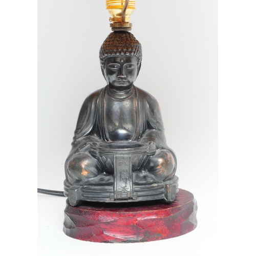 310 - 1950s Japanese copper Buddha shaped lamp base with yellow shade. Buddha mounted on a carved wooden b... 