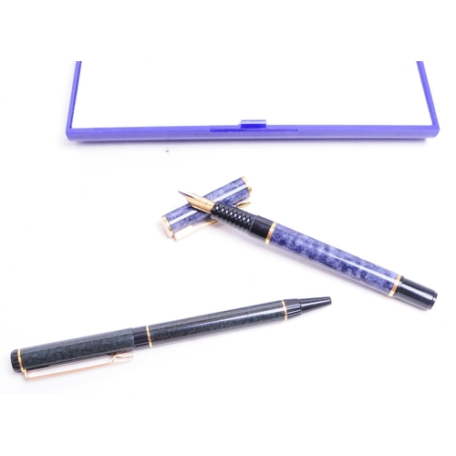 332 - Waterman - Two late 20th century French pens comprised of a textured blue cased fountain pen and a t... 