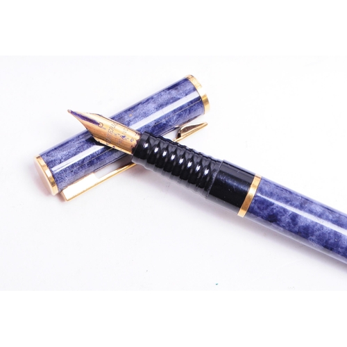 332 - Waterman - Two late 20th century French pens comprised of a textured blue cased fountain pen and a t... 