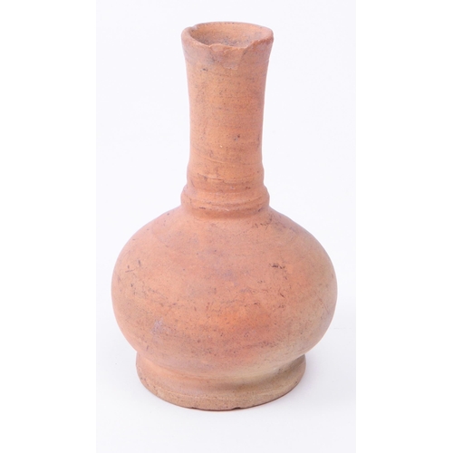 337 - Roman clay pottery artifacts comprised of an oil lamp and a small vase. Largest piece measuring appr... 