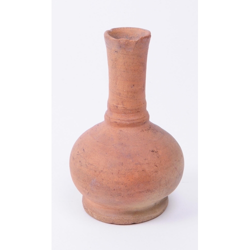 337 - Roman clay pottery artifacts comprised of an oil lamp and a small vase. Largest piece measuring appr... 